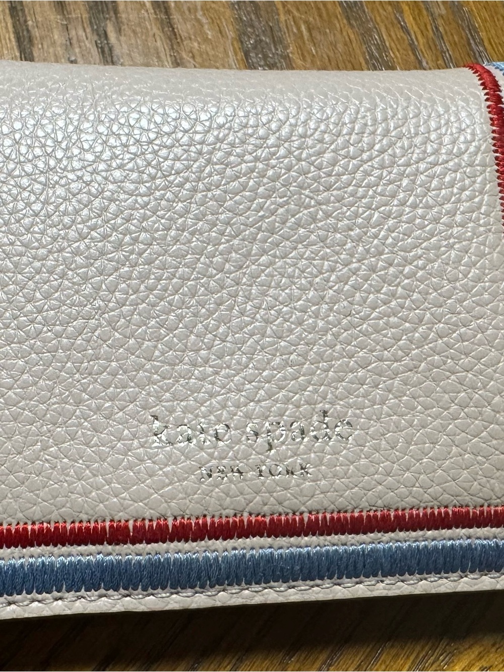 kate spade White Pebbled Leather Wallet with Red & Blue Trim - Picture 1 of 5